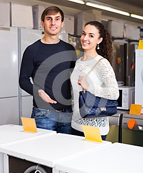 Family at household appliances store