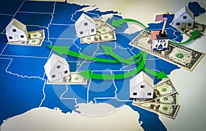 Family houses with dollar bills and central goverment tax over a US map