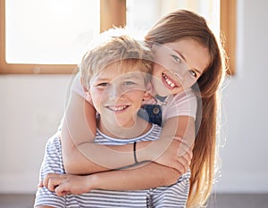 Family, hug and portrait of girl an boy in a living room, bonding and happy while enjoying quality time together. Face