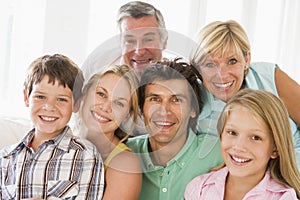 Family indoors together smiling