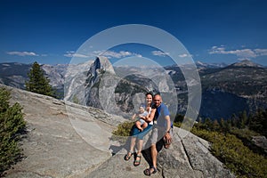 Family with infant visit Yosemite national park in California