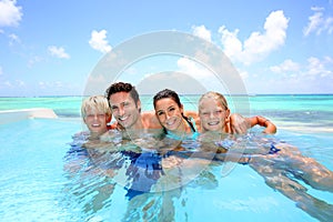 Family in infinity pool