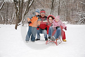 Family inforest at winter