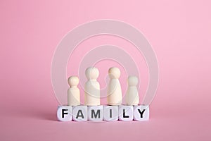 Family insurance protection onceptual.Family made of wooden peg