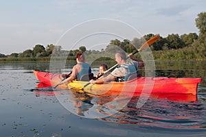 Family in a kayak on a water walk