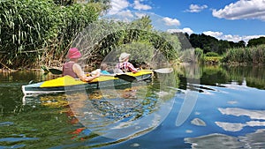 Family kayaking on the river