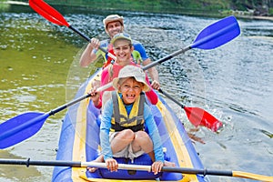 Family kayaking on the river