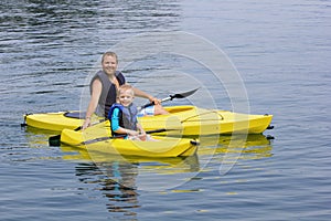 Family Kayaking together on a beautiful lake photo