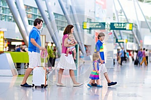 Family with kids at airport