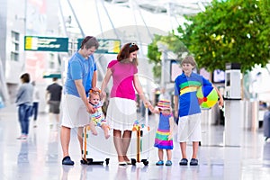 Family with kids at airport