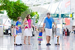 Family with kids at airport
