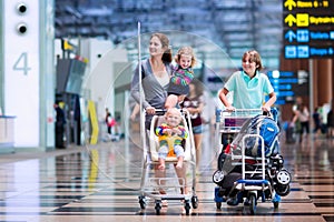 Family with kids at airport