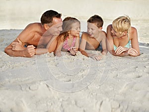 Family, kids and beach with adventure in summer on vacation for bonding and happiness in Florida. Parents, smile and