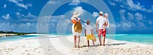 Family with kids on beach vacation