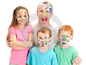Family of kids and dad with messy painted faces