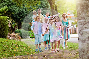 Family with kids on Easter egg hunt