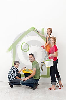 Family with kids painting their home