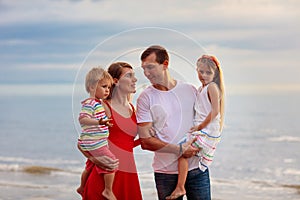 Family with kids on tropical beach. Sea vacation