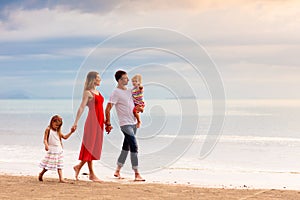 Family with kids on tropical beach. Sea vacation