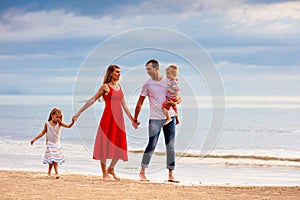 Family with kids on tropical beach. Sea vacation