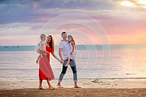 Family with kids on tropical beach. Sea vacation