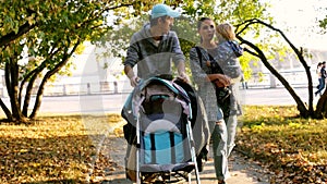 Family with kids walking through the autumn park. 3840x2160