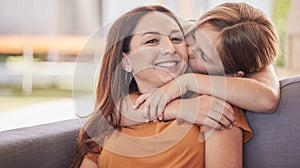 Family, kiss and girl with mother on a sofa for hug, love and sweet moment in a living room together. Portrait, happy