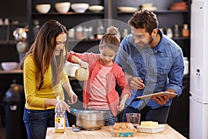 Family, kitchen and tablet for baking with care, recipe online with ingredients for cake or dessert with support and