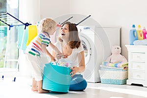 Family in laundry room with washing machine