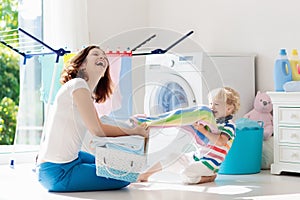 Family in laundry room with washing machine