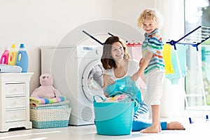 Family in laundry room with washing machine