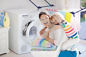 Family in laundry room with washing machine