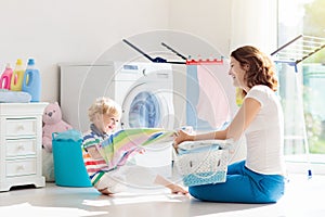 Family in laundry room with washing machine