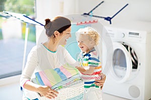 Family in laundry room with washing machine