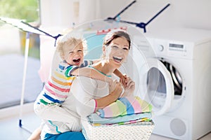 Family in laundry room with washing machine