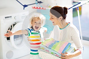 Family in laundry room with washing machine