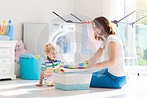 Family in laundry room with washing machine