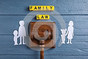 Family law concept. Flat lay composition with judge gavel on blue background