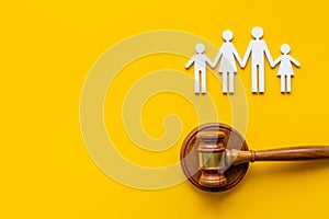 Family law or divorce concept. Family figure with judge gavel, top view