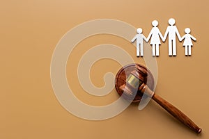 Family law or divorce concept. Family figure with judge gavel, top view