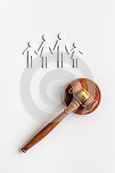 Family law or divorce concept. Family figure with judge gavel, top view