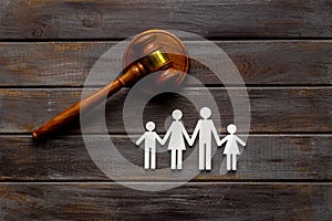 Family law or divorce concept. Family figure with judge gavel, top view