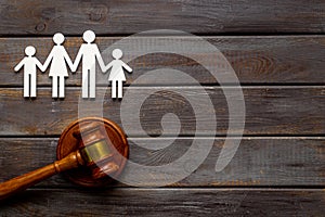 Family law or divorce concept. Family figure with judge gavel, top view