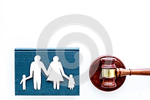 Family law, family right concept. Child-custody concept. Family with children cutout near court gavel on white