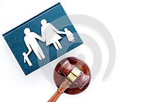 Family law, family right concept. Child-custody concept. Family with children cutout near court gavel on white