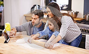 Family, learning and cooking in kitchen with tablet for recipe, guide and parents with child in home. Baking, mom and