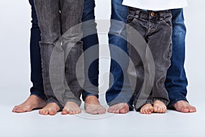 Family legs in jeans portrait