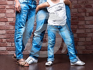 Family legs wearing blue jeans