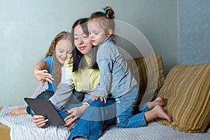 Family leisure at home, children communicate online with friends and relatives