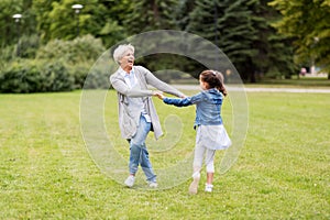 Grandmother and granddaughter playing at park